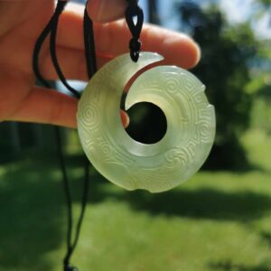 a hand holding a Jade Hook